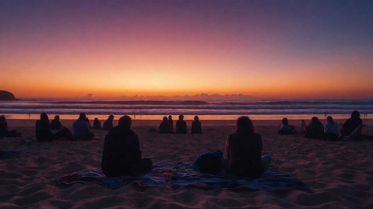 Silhouettes watching sunset over Sydney beach coastline